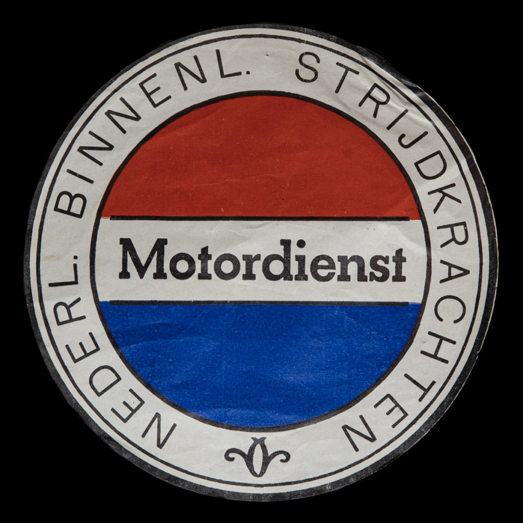 Papieren embleem van de Motordiest Nederlandsche Binnenlandse Strijdkrachten