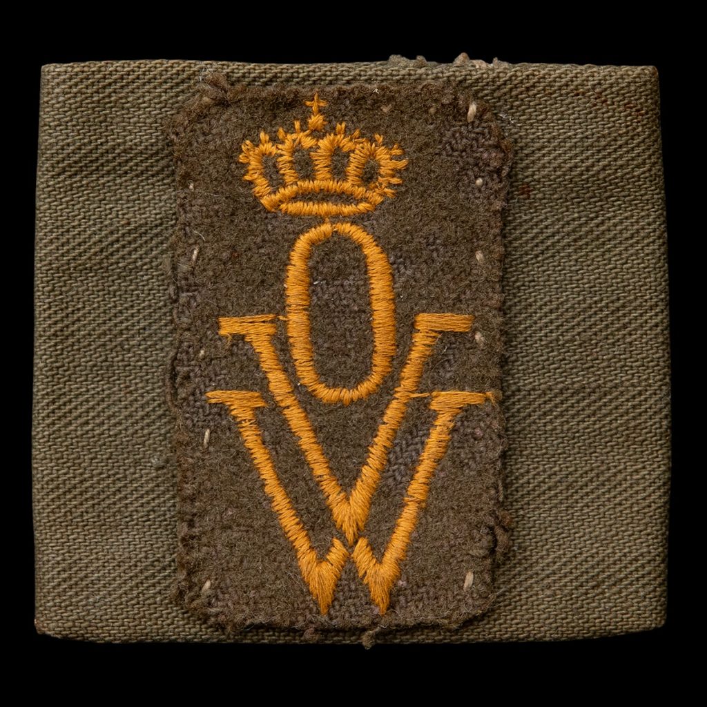 Embleem OVW op een schouderstrap