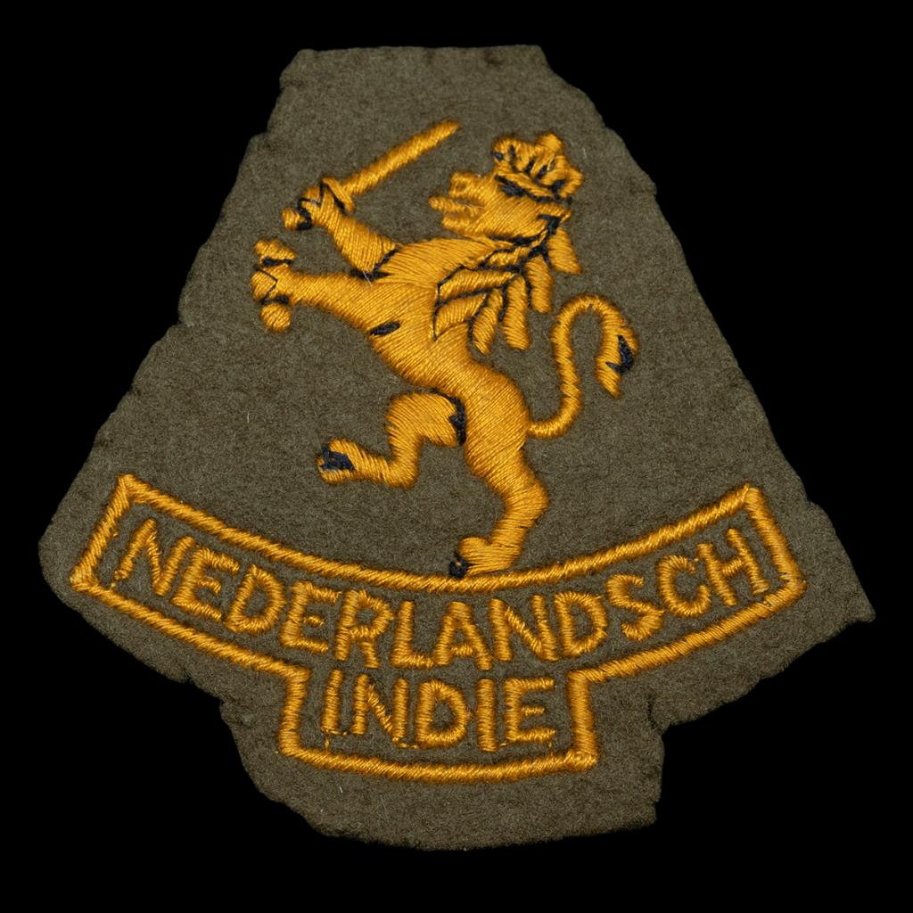 Mouwleeuw Nederlandsch Indië Model 1940 vroeg Engelse Aanmaak geweven Op Vilt.